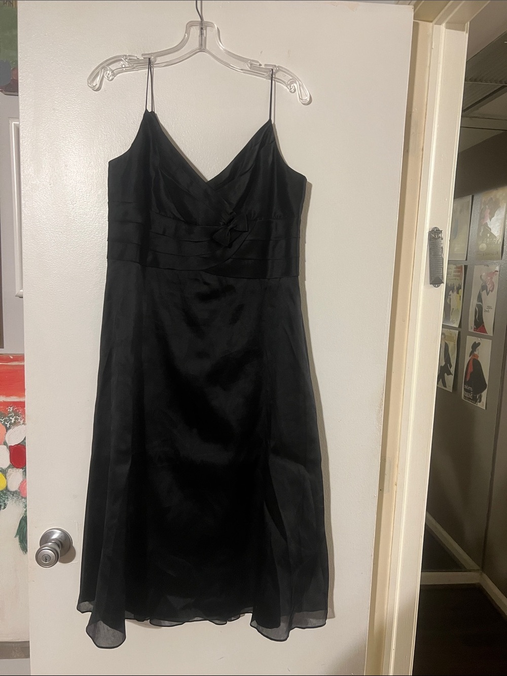 Carmen Marc Valvo black 100% silk cocktail dress. Hidden back zip closure.